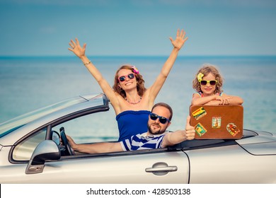 Happy Family Travel By Car To The Sea. People Having Fun In Cabriolet. Summer Vacation Concept