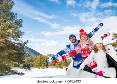 Happy Family Travel By Car. People Having Fun In The Mountains. Father, Mother And Child On Winter Vacation. Healthy Active Lifestyle Concept