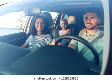 Happy Family Traveling By Car On Summer Day