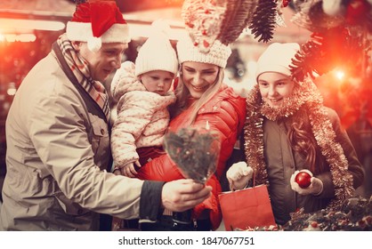 Happy Family With Two Beautiful Children Female Children Spending Time At Christmas Fair