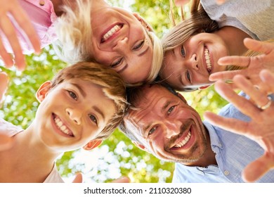 Happy Family With Two Children Happily Waves On Summer Vacation