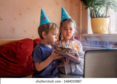 Happy family with two sibling celebrating birthday via internet in quarantine time, self-isolation and family values, online birthday party