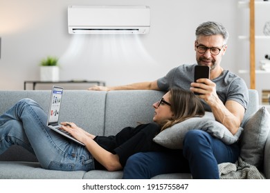 Happy Family Using Air Condition In House