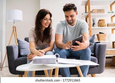 Happy Family Using Calculator For Tax And Budget