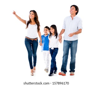 Happy Family Walking An Pointing Away - Isolated Over White Background 