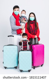 Happy Family Wearing Warm Clothes And Medical Mask On White Background. And Winter Vacation Concepts