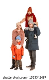 Happy Family In Winter Clothes On White Background