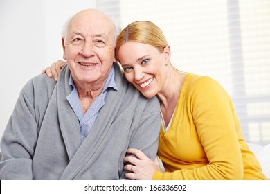 Happy Family With Woman Embracing Senior Citizen Man