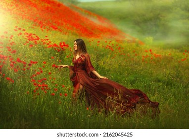 Happy Fantasy Woman Queen In Red Silk Dress, Walking In Poppy Field, Summer Green Grass, Nature Flowers. Girl Goddess Princess Train Hem Skirt Flying In Wind, Satin Fabric Waving. Divine Sun Light