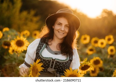 Happy Farm Girl In A Dress In A Field Of Sunflowers.