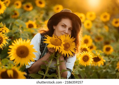 Happy Farm Girl In A Dress In A Field Of Sunflowers.