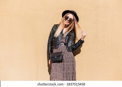 Happy Fashion Woman With Autumn Trendy Outfit In Stylish Leather Jacket And Dress With Black Small Bag