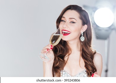 Happy Fashion Woman Drinking Champagne