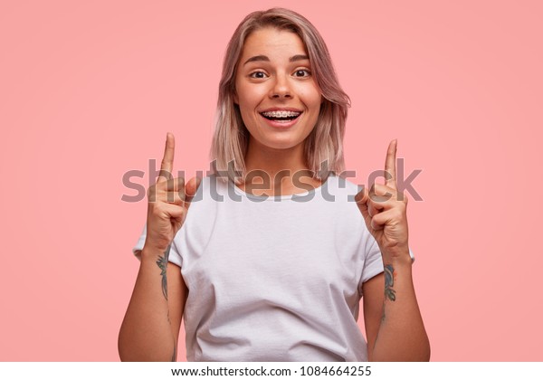 Happy Fashionable Female Hipster Has Tattooed Stock Photo