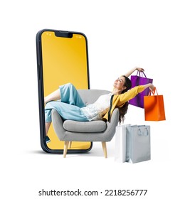 Happy fashionable young woman sitting and holding shopping bags in a smartphone, she is doing online shopping, blank copy space - Shutterstock ID 2218256777