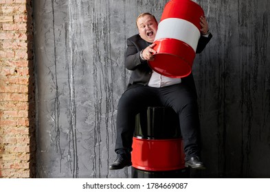 Happy Fat Caucasian Businessman Is Not Ready To Give Someone His Profit On Oil Production, Man Hugs Red Oil Barrel