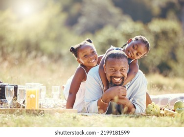 Happy Father And Children On A Family Picnic On Nature Field In Summer Together. Portrait Man And Girl With Playful Fun Outdoor In A Green Nature Forest With A Smile And Love While Bonding In Spring