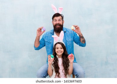 Happy Father And Daughter Celebrate Easter. Happy Easter Holiday. Small Girl Wear Funny Bunny Ears With Dad. Family Began Easter Egg Hunt. Spring Holiday Season. Rabbit Family Party.