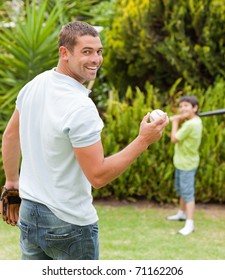 Happy Father And His Son Playing Baseball