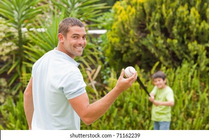 Happy Father And His Son Playing Baseball