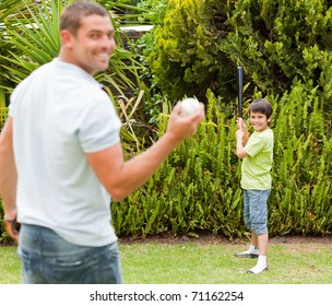 Happy Father And His Son Playing Baseball