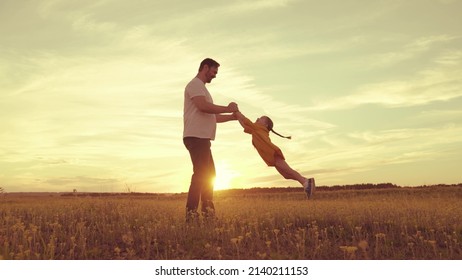 happy father husband spin child kid air. childhood dream fly. little child superhero flies playing with dad. happy family weekend vacation park. holiday journey laughing child daughter. mood happy - Powered by Shutterstock