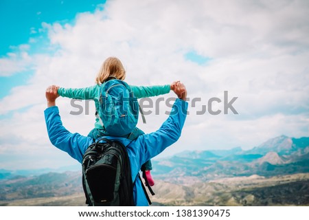 happy father with little daughter travel in nature