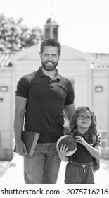 Happy Father With Nerd Son In Glasses Hold Ball And Book First Day At School, Family Values.