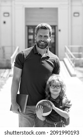 Happy Father With Nerd Son In Glasses Coming Back From First Day At School, Family Support.