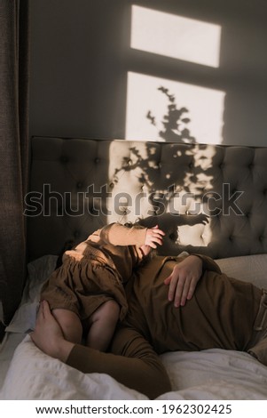 Similar – a girl with her hair by her face lying on the bed