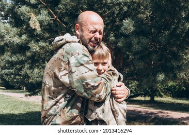 Happy Father And Son In Camouflage Outside In Park, Father's Day Concept And Greetings, Laser Tag Military War Game For Birthday Party, Father Return Home Family Reunion