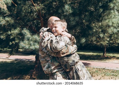 Happy Father And Son In Camouflage Outside In Park, Father's Day Concept And Greetings, Laser Tag Military War Game For Birthday Party, Father Return Home Family Reunion