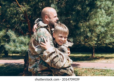 Happy Father And Son In Camouflage Outside In Park, Father's Day Concept And Greetings, Laser Tag Military War Game For Birthday Party, Father Return Home Family Reunion