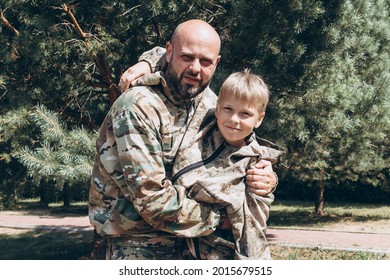 Happy Father And Son In Camouflage Outside In Park, Father's Day Concept And Greetings, Laser Tag Military War Game For Birthday Party, Father Return Home Family Reunion