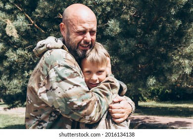 Happy Father And Son In Camouflage Outside In Park, Father's Day Concept And Greetings, Laser Tag Military War Game For Birthday Party, Father Return Home Family Reunion