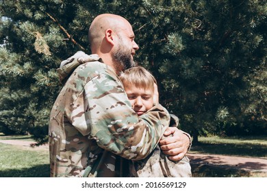 Happy Father And Son In Camouflage Outside In Park, Father's Day Concept And Greetings, Laser Tag Military War Game For Birthday Party, Father Return Home Family Reunion