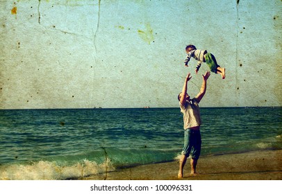 Happy father and son on the beach - Shutterstock ID 100096331