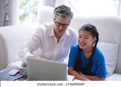 Happy Father And Tween Daughter Online Learning Class