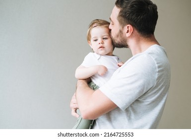 Happy Father Young Man Kissing Baby Girl Little Daughter At Home