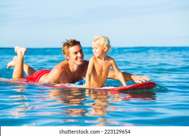 Happy Father And Young Son Going Surfing Together. Fatherhood Concept, Quality Time With Child.