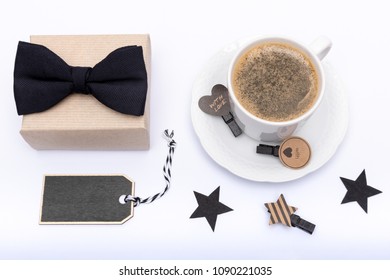 Happy Father's Day Background. Cup of coffee, beautiful present and black bow tie on white background flat lay. Fathers day still life setup. - Powered by Shutterstock