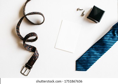 Happy Father's Day Background With Stylish Belt, Blue Tie, Cufflinks And Mock Up Card On White Background With Copy Space. Greetings And Presents For Dad. Dad And Daughter. Business Man. Office