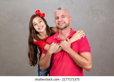 Happy Fathers Day! Happy Caucasian Father And Daughter Hugging On Plain Background With Copy Space