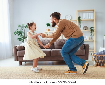 Happy Father's Day! Family Dad And Child Daughter Princess Dancing At Home   
