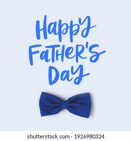 Happy Fathers Day. Festive concept with bow tie on a blue pastel background. 