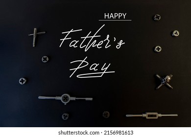Happy Father's Day. Flat lay on father's day theme. Black background. On the topic of car mechanic and motorcyclist, biker
