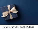 Happy Fathers Day gift box on navy blue background. Flat lay, top view.