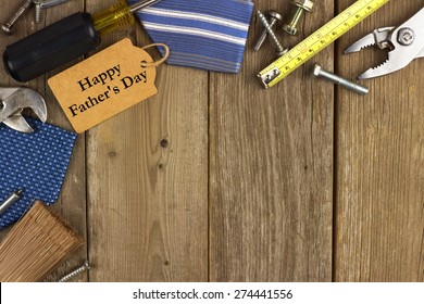 Happy Fathers Day gift tag with corner border of tools and ties on a rustic wood background - Powered by Shutterstock