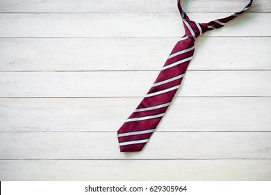 Happy Father's Day inscription with colorful tie on wooden background floor background. - Powered by Shutterstock