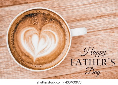 Happy Fathers Day Message Next To Coffee On Desk